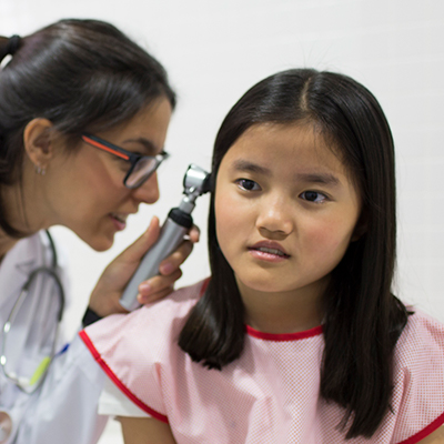 Female doctor examining a girl's ear. Beaver Dam Community Hospital ear nose throat